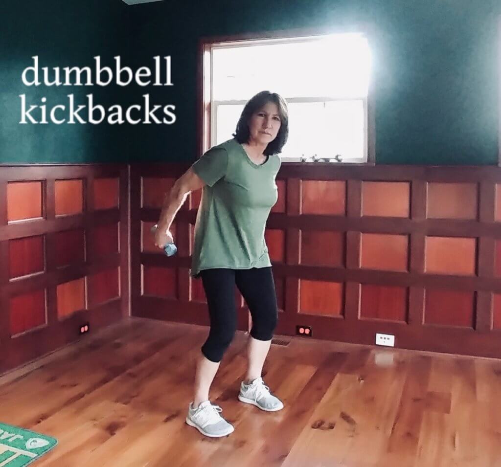 dumbbell kickbacks for arm workout